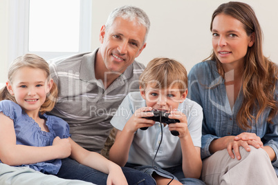 Charming family playing video games