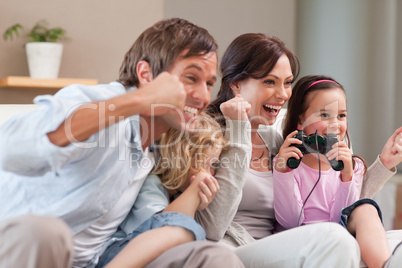 Positive family playing video games together