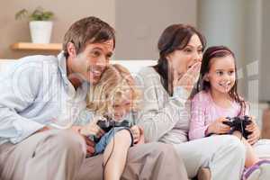 Competitive family playing video games