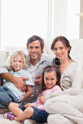 Portrait of a family relaxing on a sofa