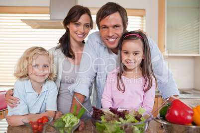 Family preparing a salad