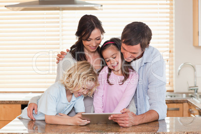 Family using a tablet computer together