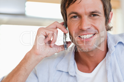 Close up of a man making a phone call