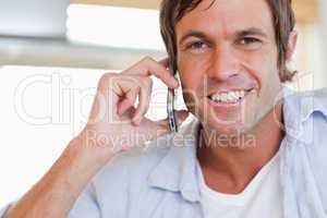 Close up of a man making a phone call
