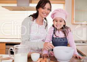 Mother baking with her daughter