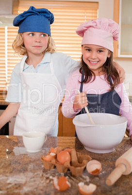 Portrait of siblings baking together