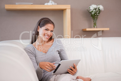 Woman with tablet pc on the couch