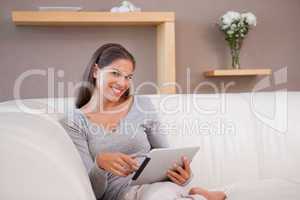 Woman with tablet pc on the couch