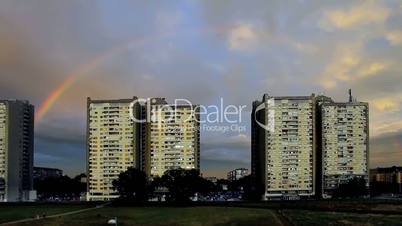 Rainbow In The City On Summer Day