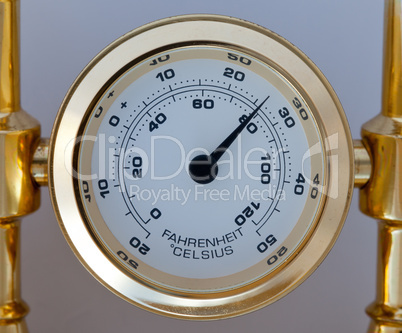 Gold colored thermometer