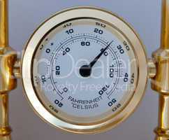 Gold colored thermometer