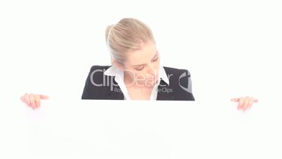 Surprised Businesswoman Holding Board