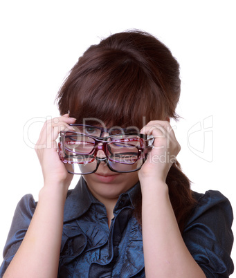 attractive woman holding her eyeglasses