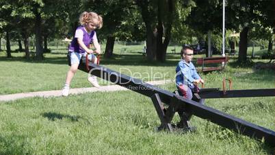 children fun on seesaw