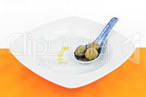 Spoon with olives.