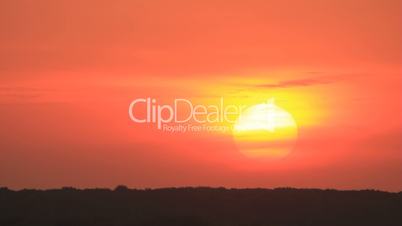 Sunset on red sky time-lapse background - long shot