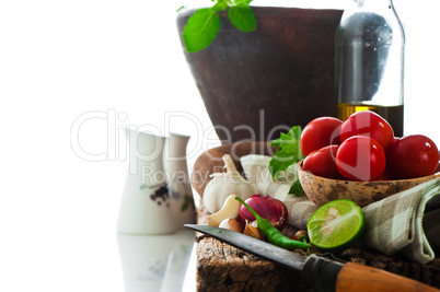 fresh vegetables and olive oil on an old weathered wood with a o