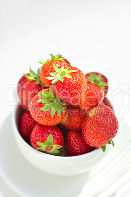 strawberries in a bowl in the daylight