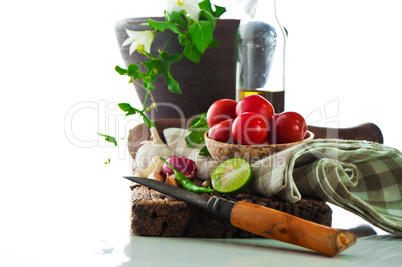 fresh vegetables and olive oil on an old weathered wood with a o