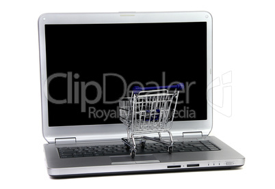 shopping cart in front of black laptop screen