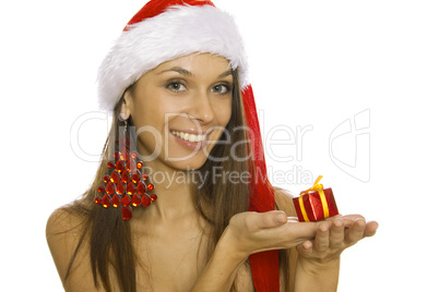 Santa woman holding gift wearing Santa hat
