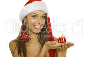 Santa woman holding gift wearing Santa hat