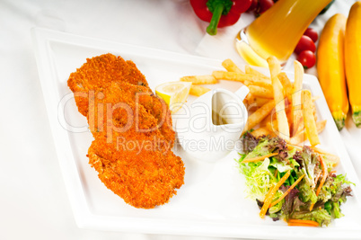 classic Milanese veal cutlets and vegetables