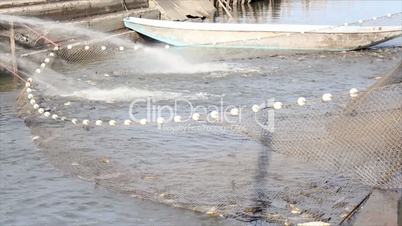 fishpond with driftnet and fish