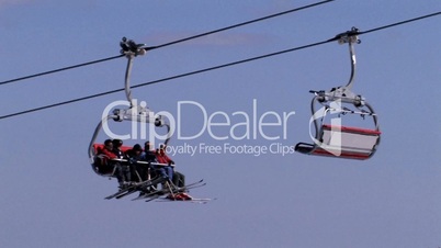 Ski lift passing by with skiers