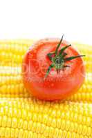 background of ripe yellow corn and tomato