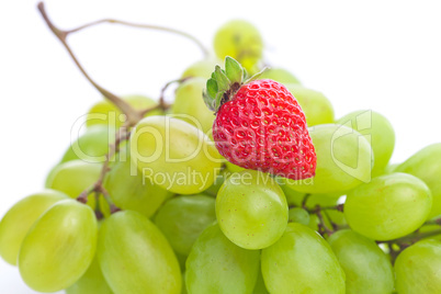 bunch of white grapes and strawberries isolated on white
