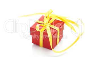 red gift box with a yellow ribbon isolated on white