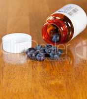 Blueberries in drug bottle