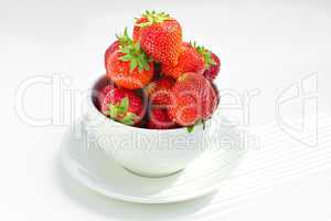 strawberries in a bowl in the daylight