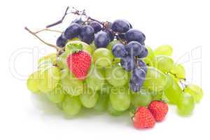 bunch of white and black grapes and strawberries isolated on whi