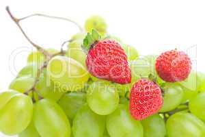 bunch of white grapes and strawberries isolated on white