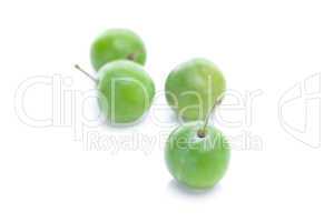 green plum isolated on white