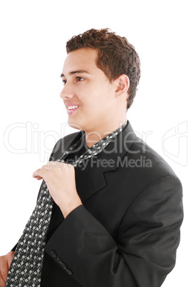 An young man fixing his tie