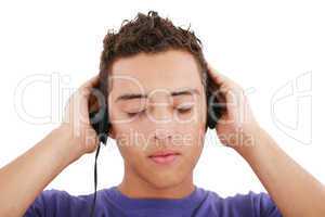 Boy listening to the music, isolated on white