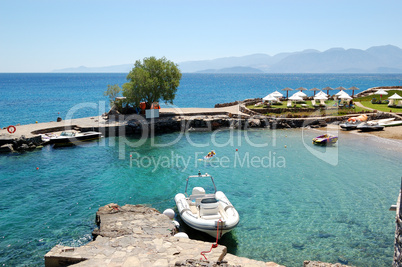 Beach and motor boats at the luxury hotel, Crete, Greece