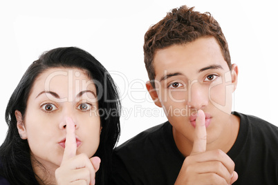 Friends or couple showing silence sign. Isolated on white