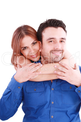 woman holding with love her boyfriend from behind, posing at cam