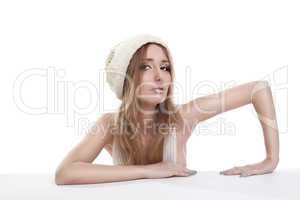 Cute blond woman in white cap look at you