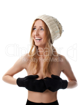 Happy blond woman close breast with mitten