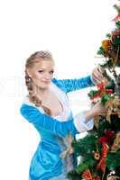 Young christmas girl decorate new year fir tree