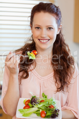 Girl eating salad