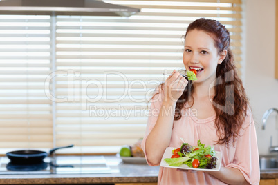 Girl having healthy salad