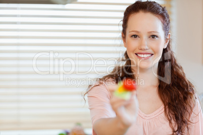 Girl offering a mouthful of salad