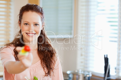 Woman offering some salad