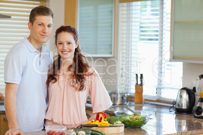 Couple standing behind kitchen counter